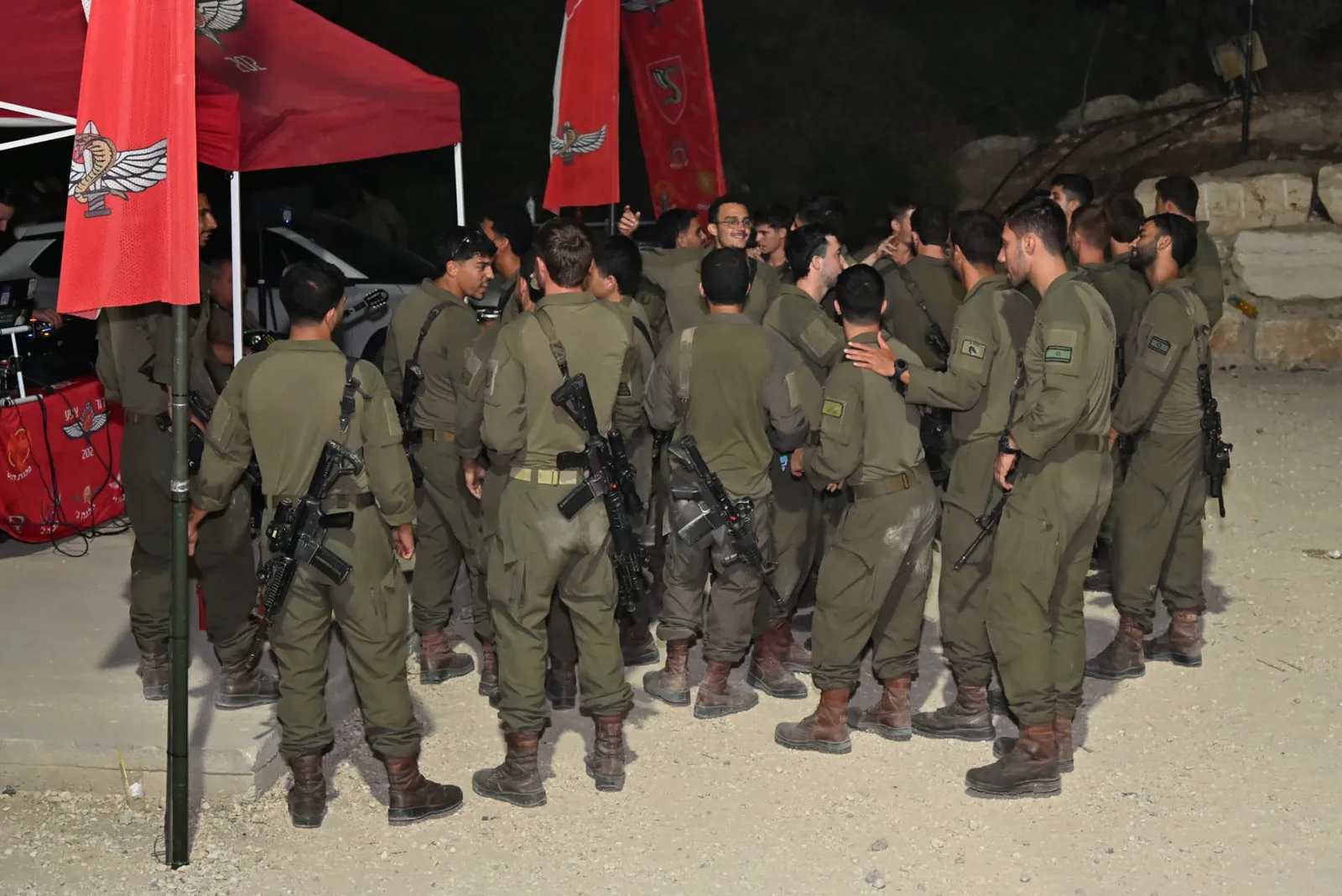 Soldiers gathered together under the battalion flags