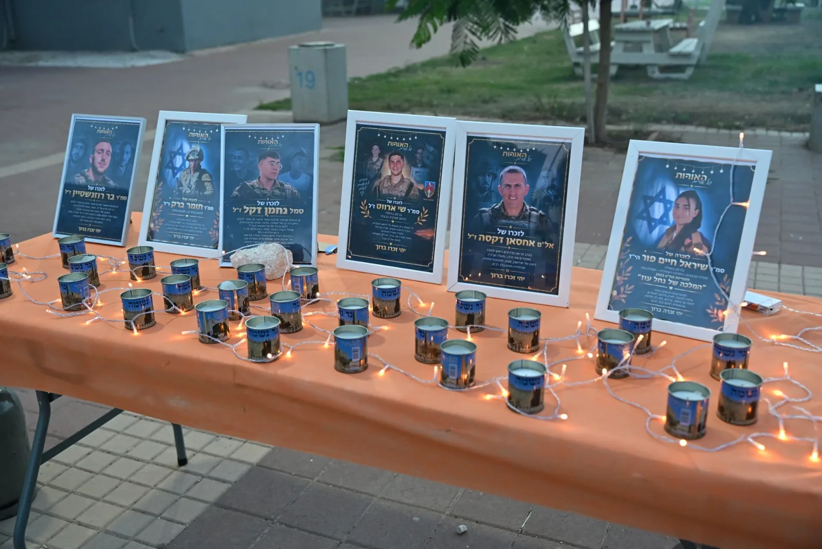 Memorial portraits and candles arranged on the remembrance table