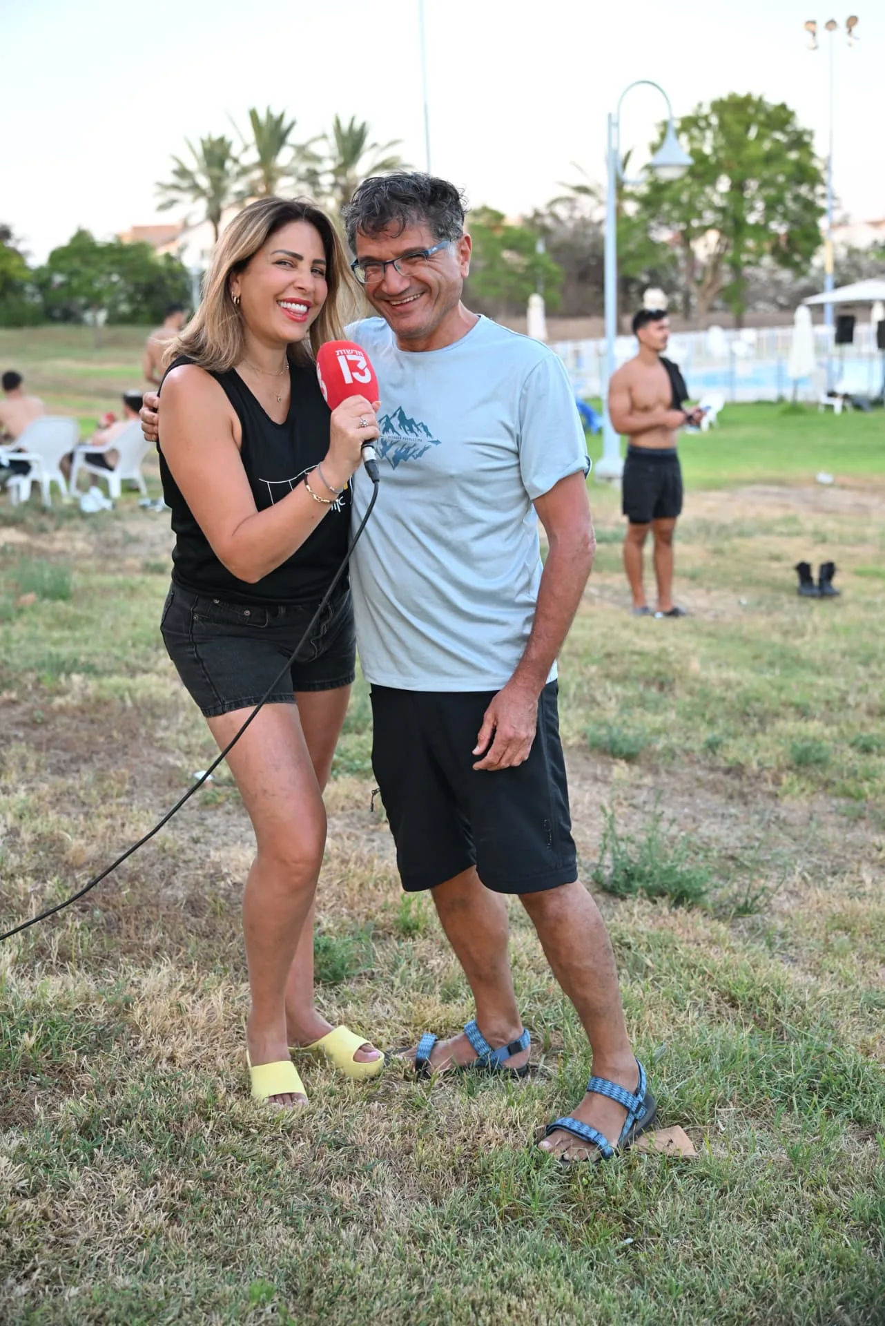 News reporter interviewing a volunteer at the event