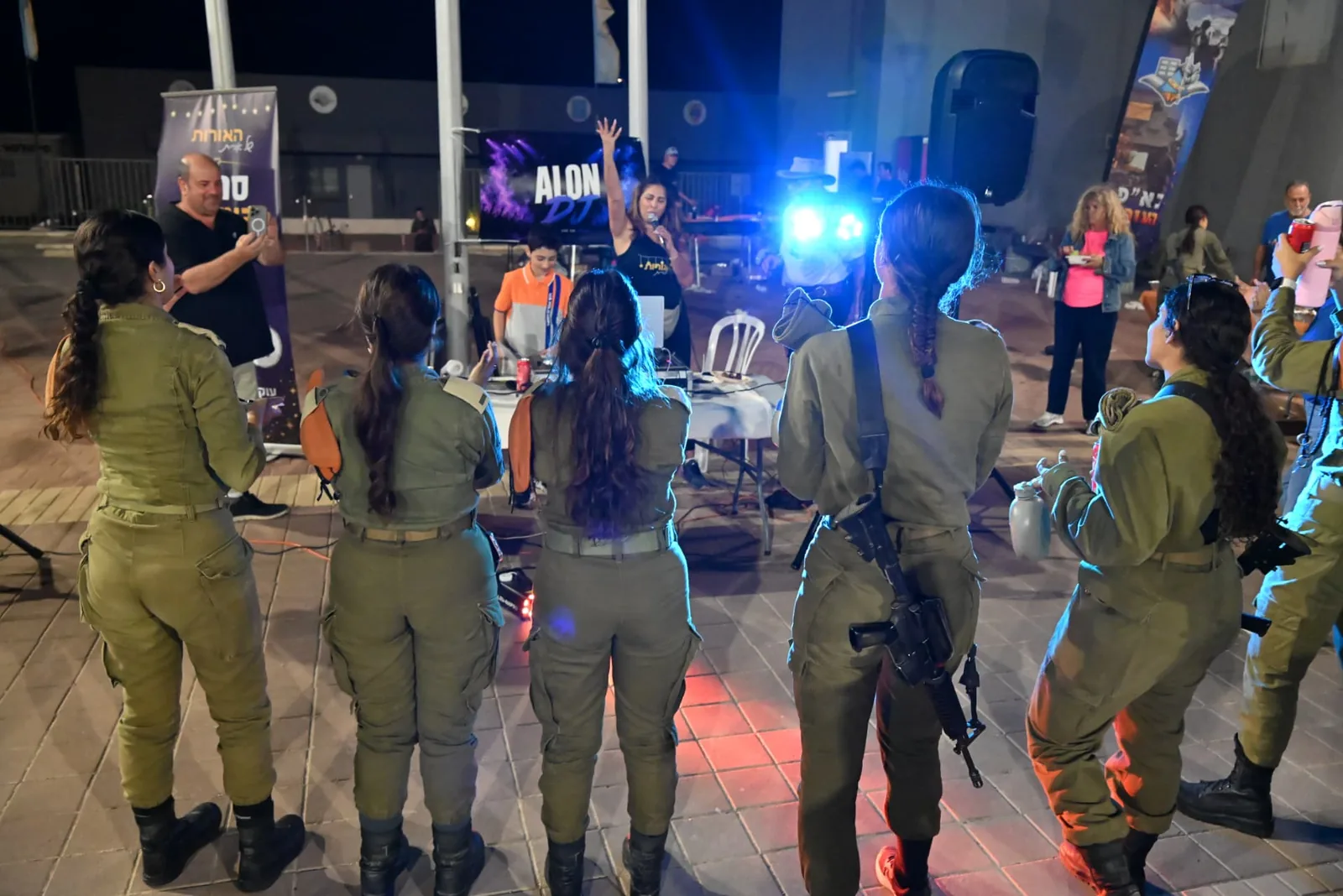 Soldiers and volunteers gathered near the music and lights