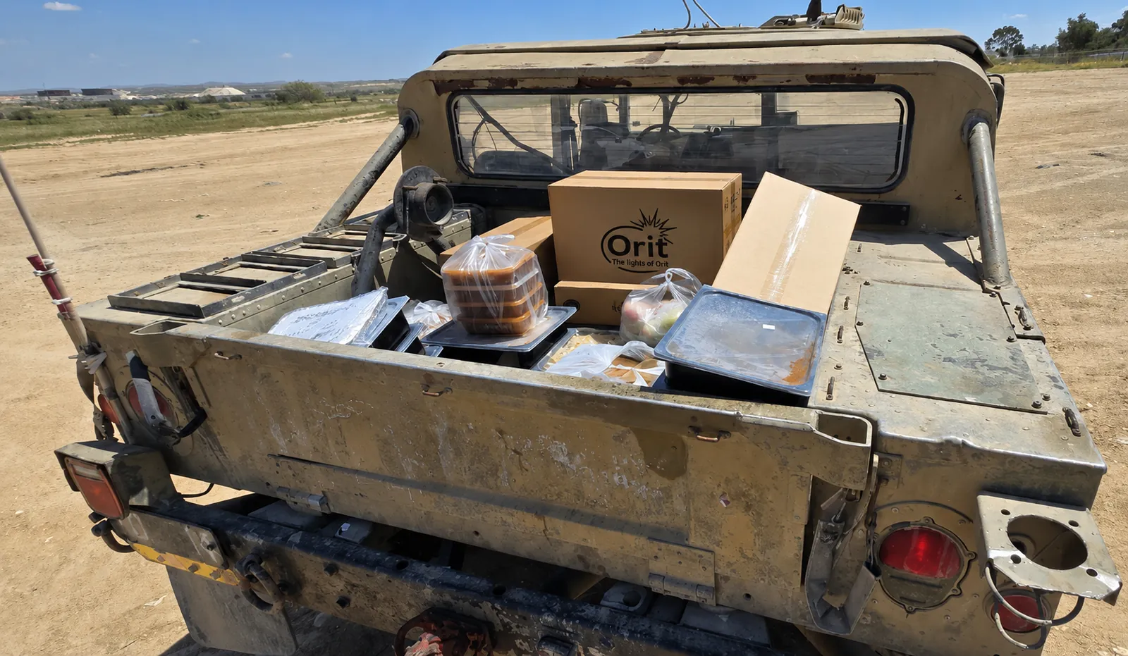 Meals transfered to military vehicle to be delivered to the front line