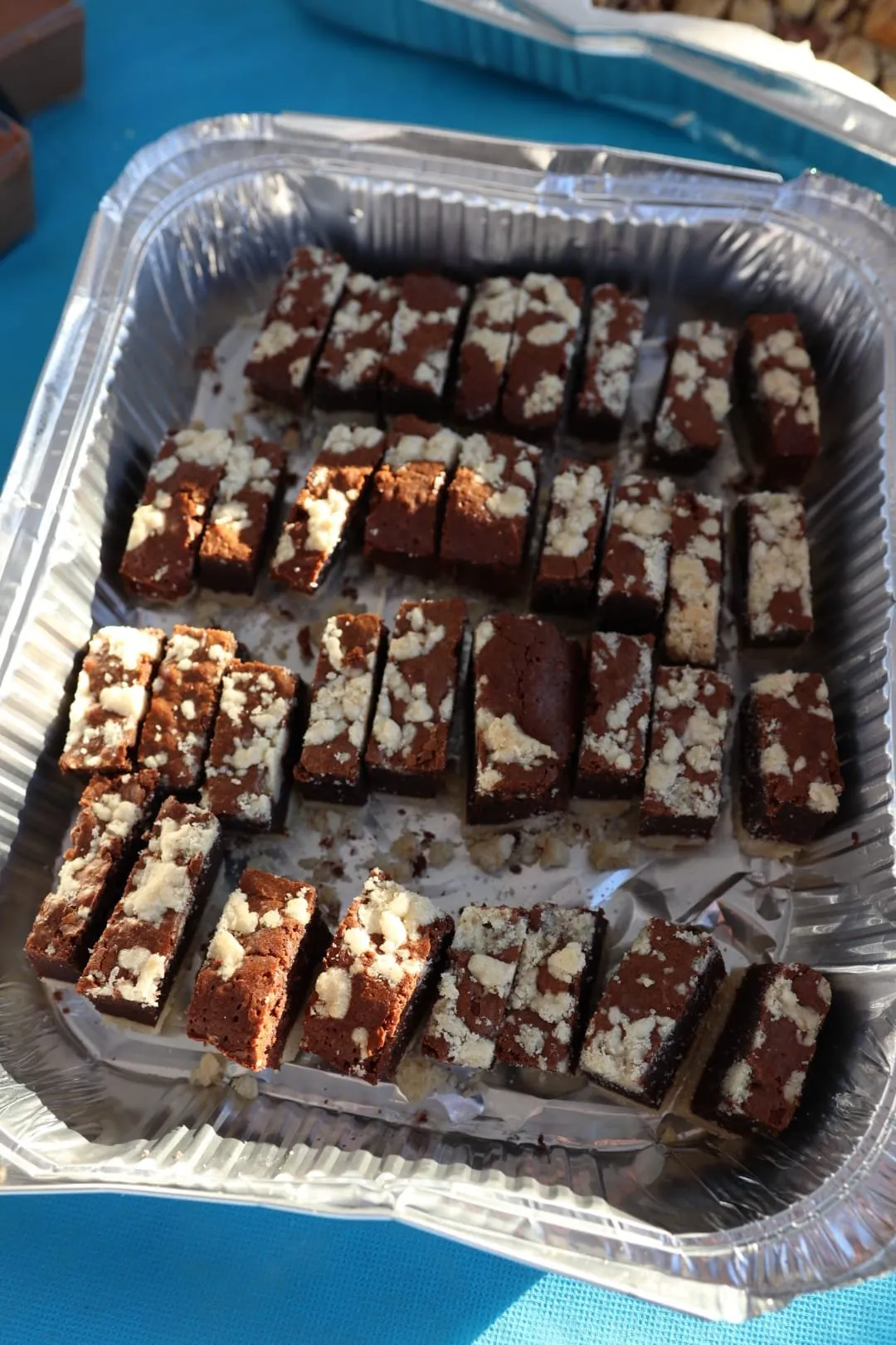 A tray of homemade chocolate crumble brownies for dessert