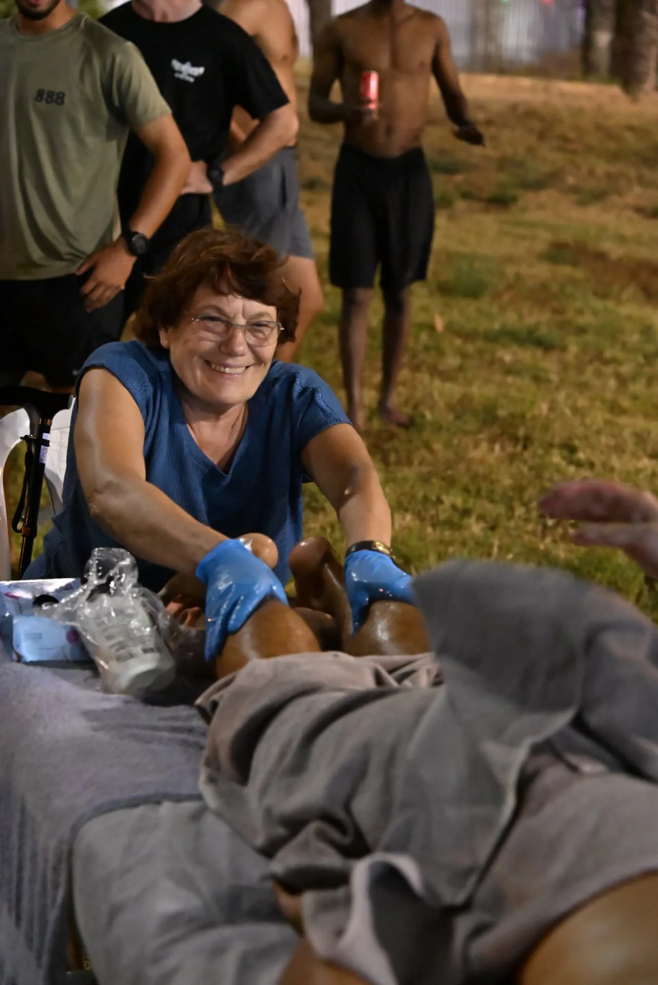 Smiling volunteer therapist working into the night