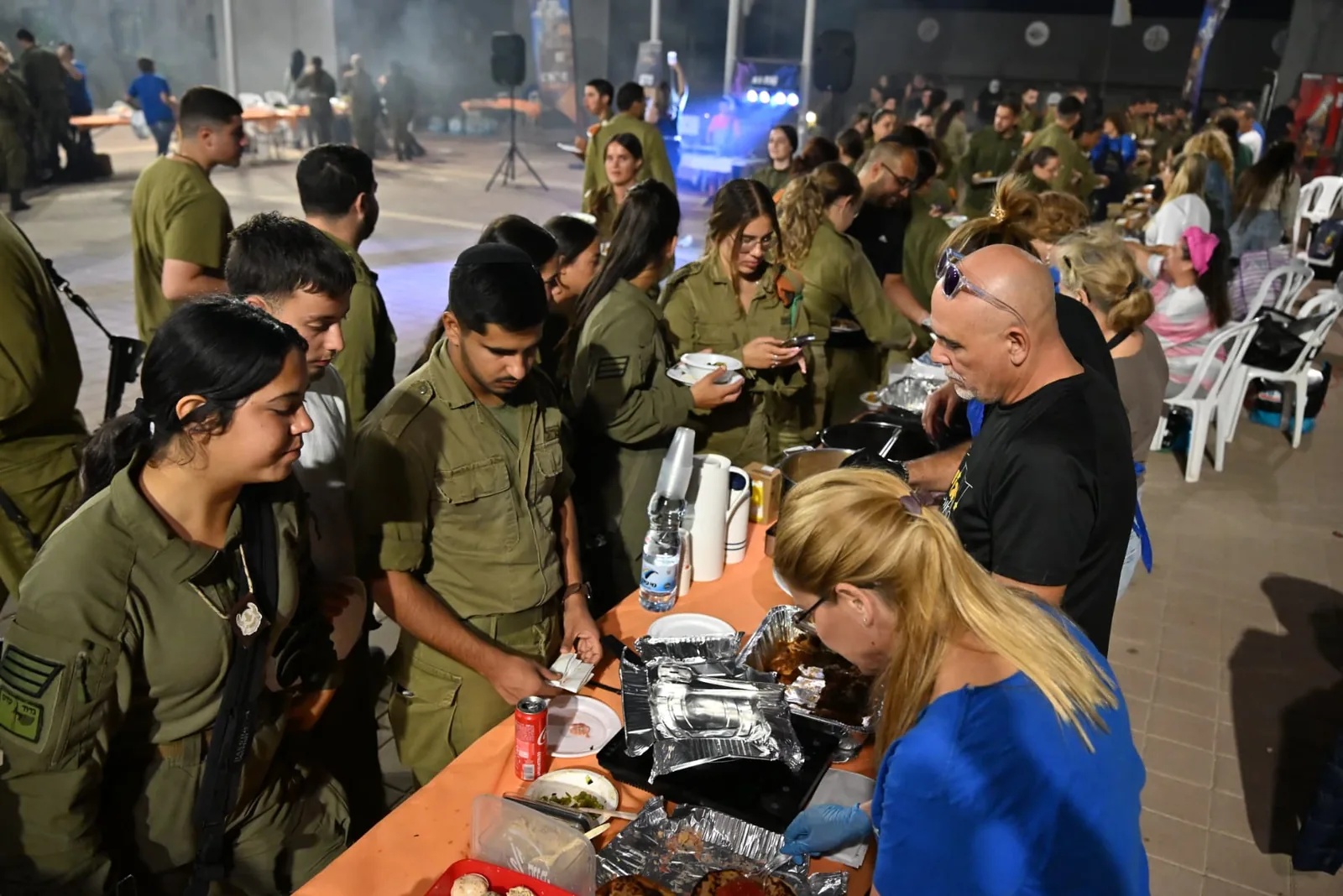 Soldiers choosing refreshments from the serving table