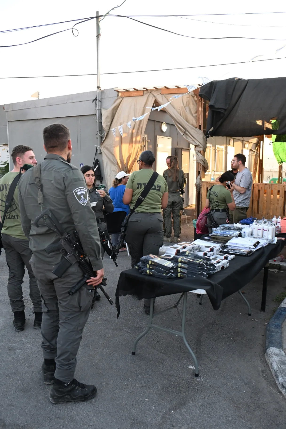 A table of gifts and personal-care supplies laid out for the soldiers