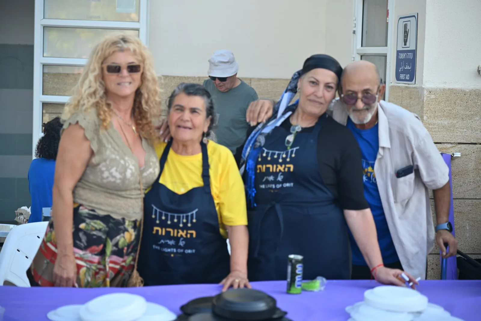 Four volunteers behind the serving table