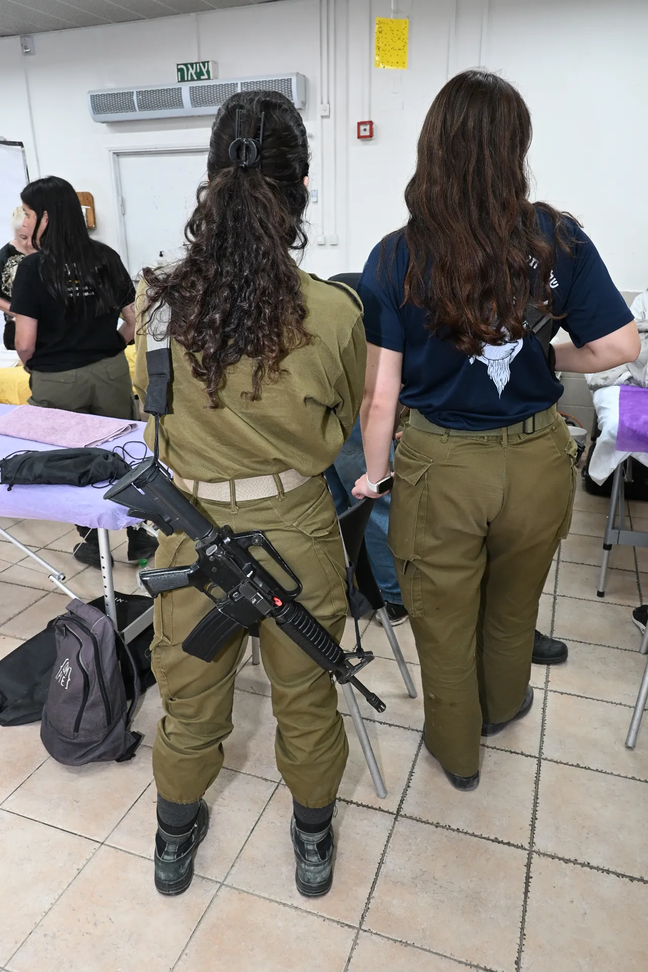 Soldiers wait their turn for a moment of care
