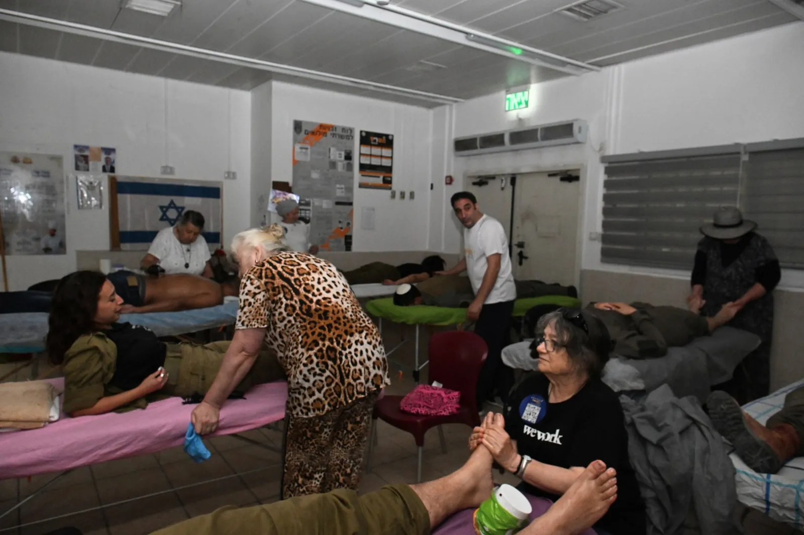 Volunteers giving massages and treatments to soldiers in a relaxation room