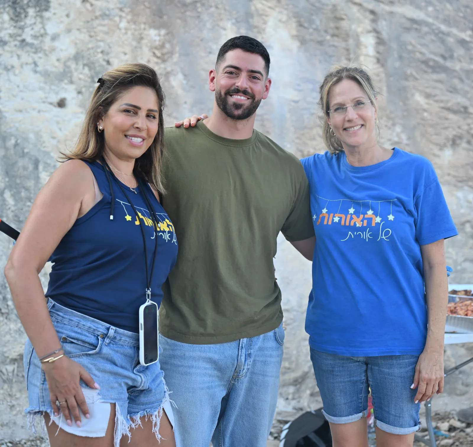 Volunteers and a soldier together at the event