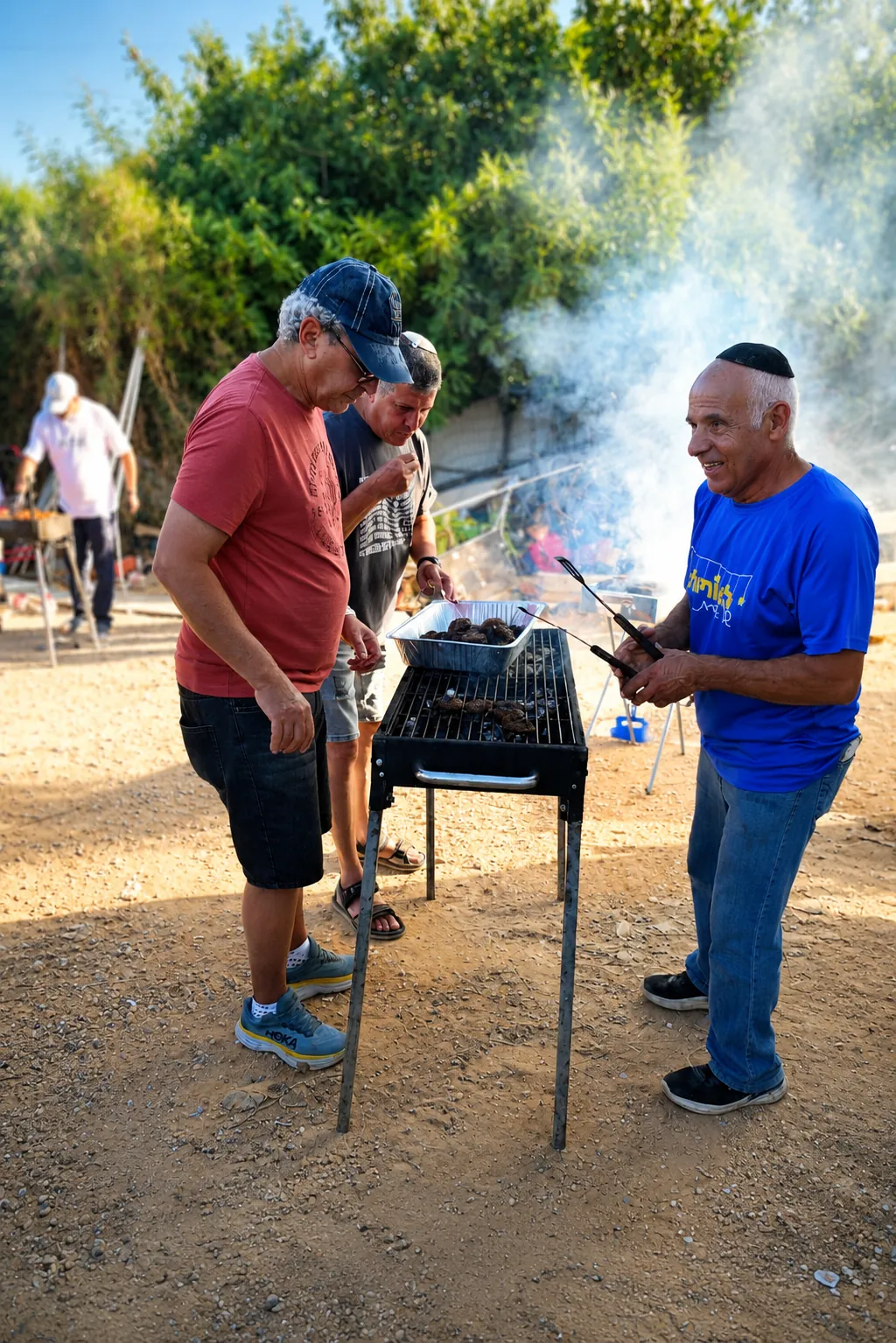 Volunteers grilling fresh food outdoors for the Arbel battalion event