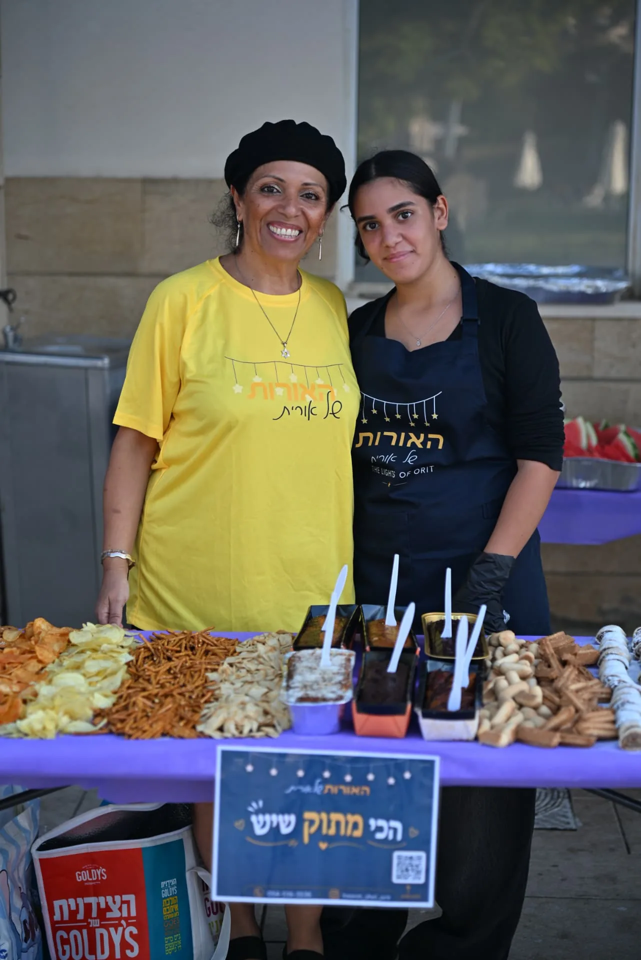Volunteers at the dessert and snack table
