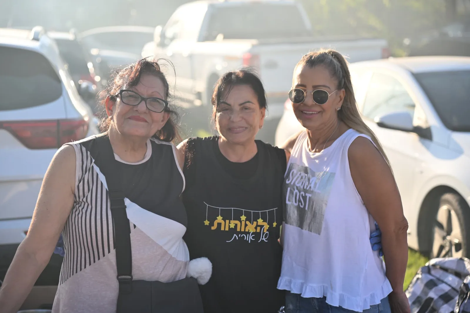 Three volunteers arriving at the event