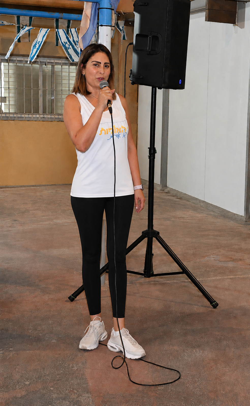 Orit Cohen Peleg speaking at a community event