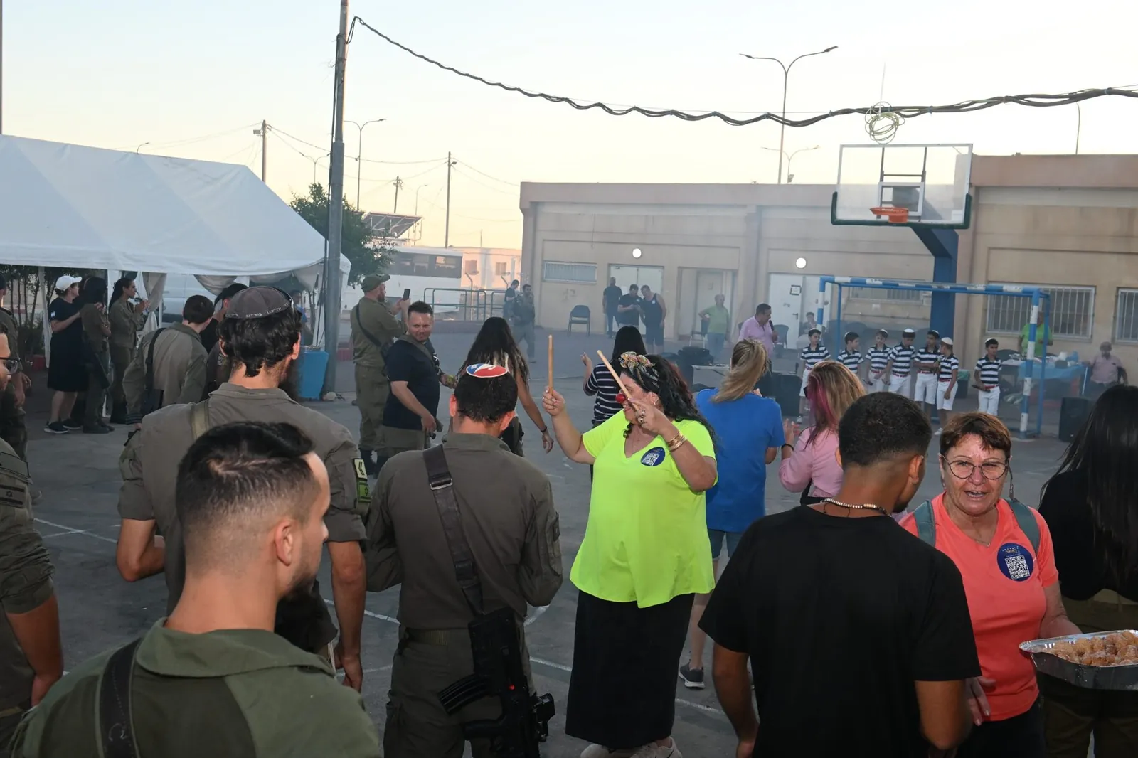 Soldiers and supporters celebrating together with music at the evening