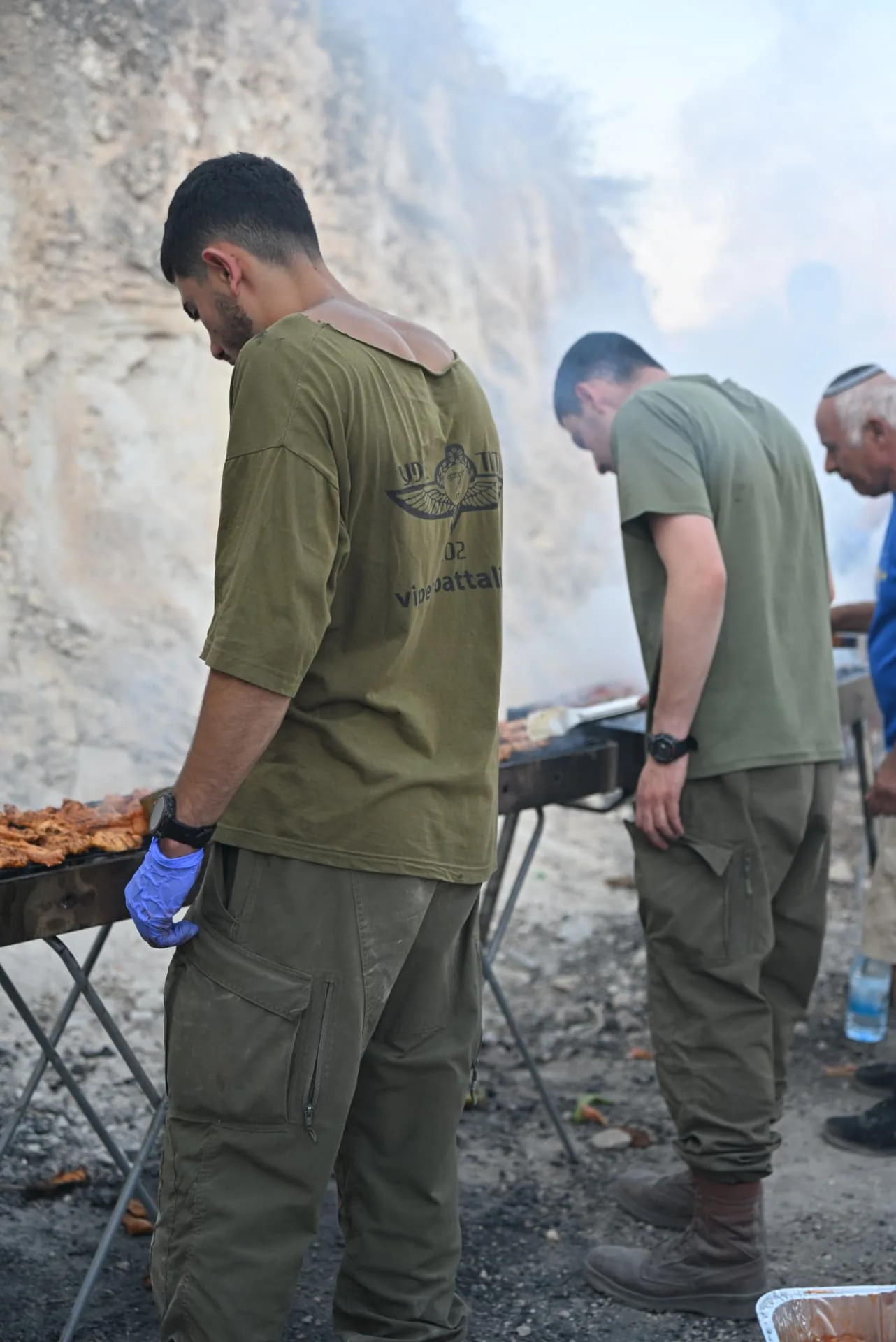 Soldiers tending the grills