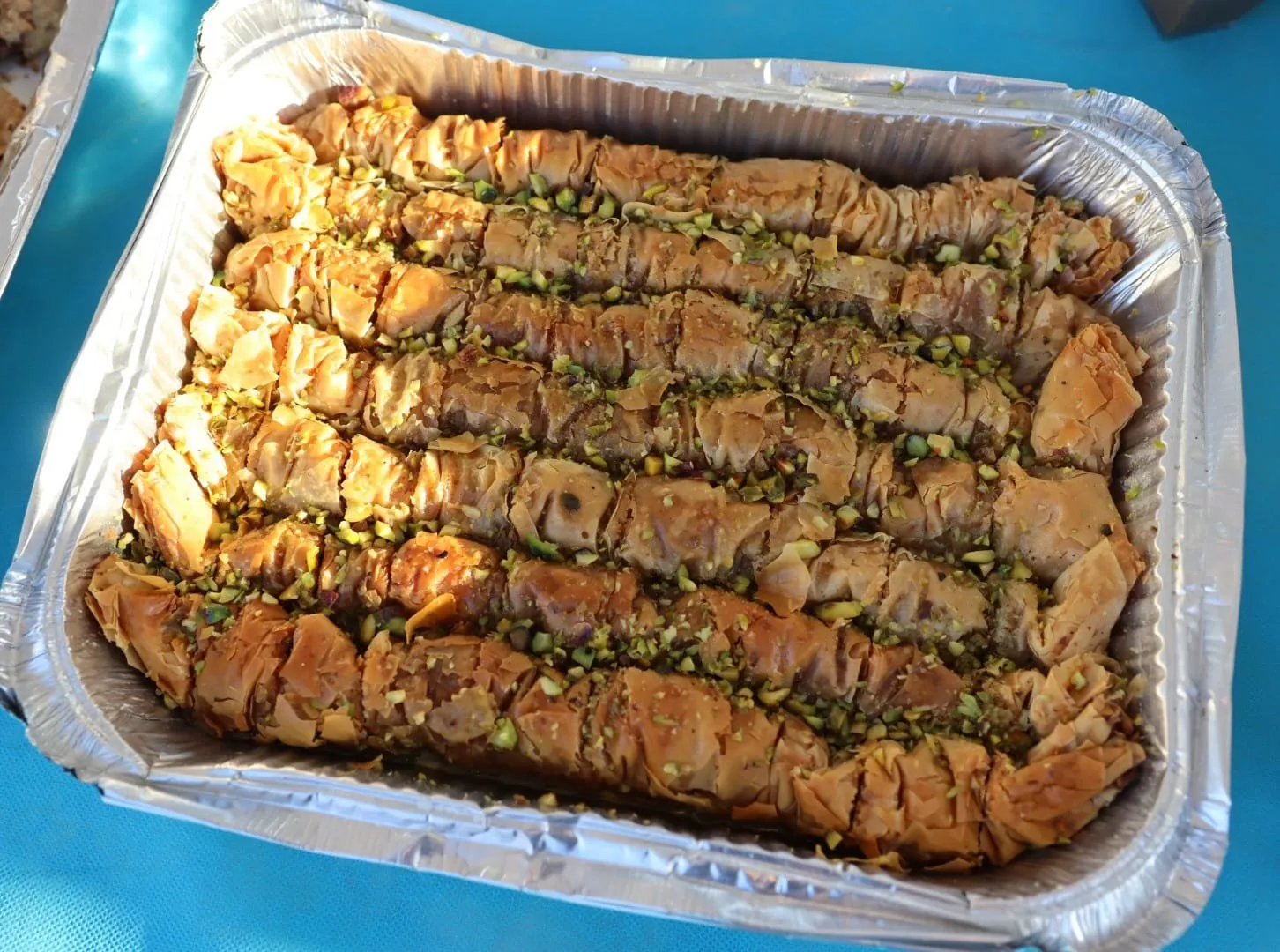 A tray of freshly made pistachio baklava prepared for the soldiers