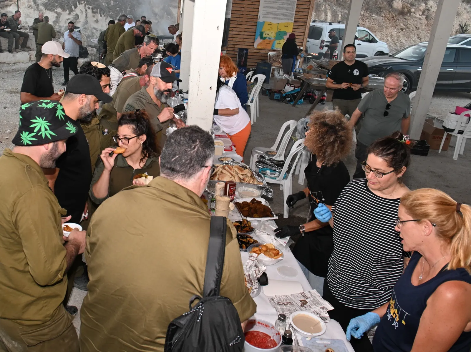 Soldiers being served a generous spread of food