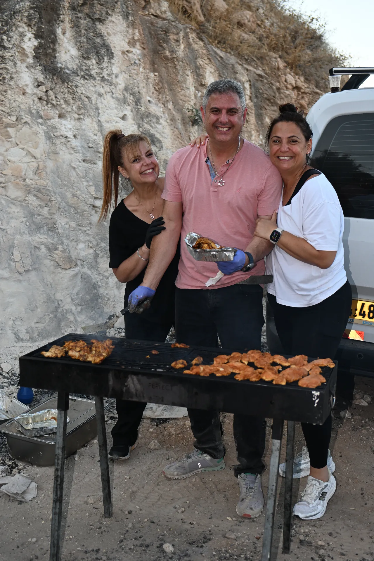 Volunteers grilling at the event
