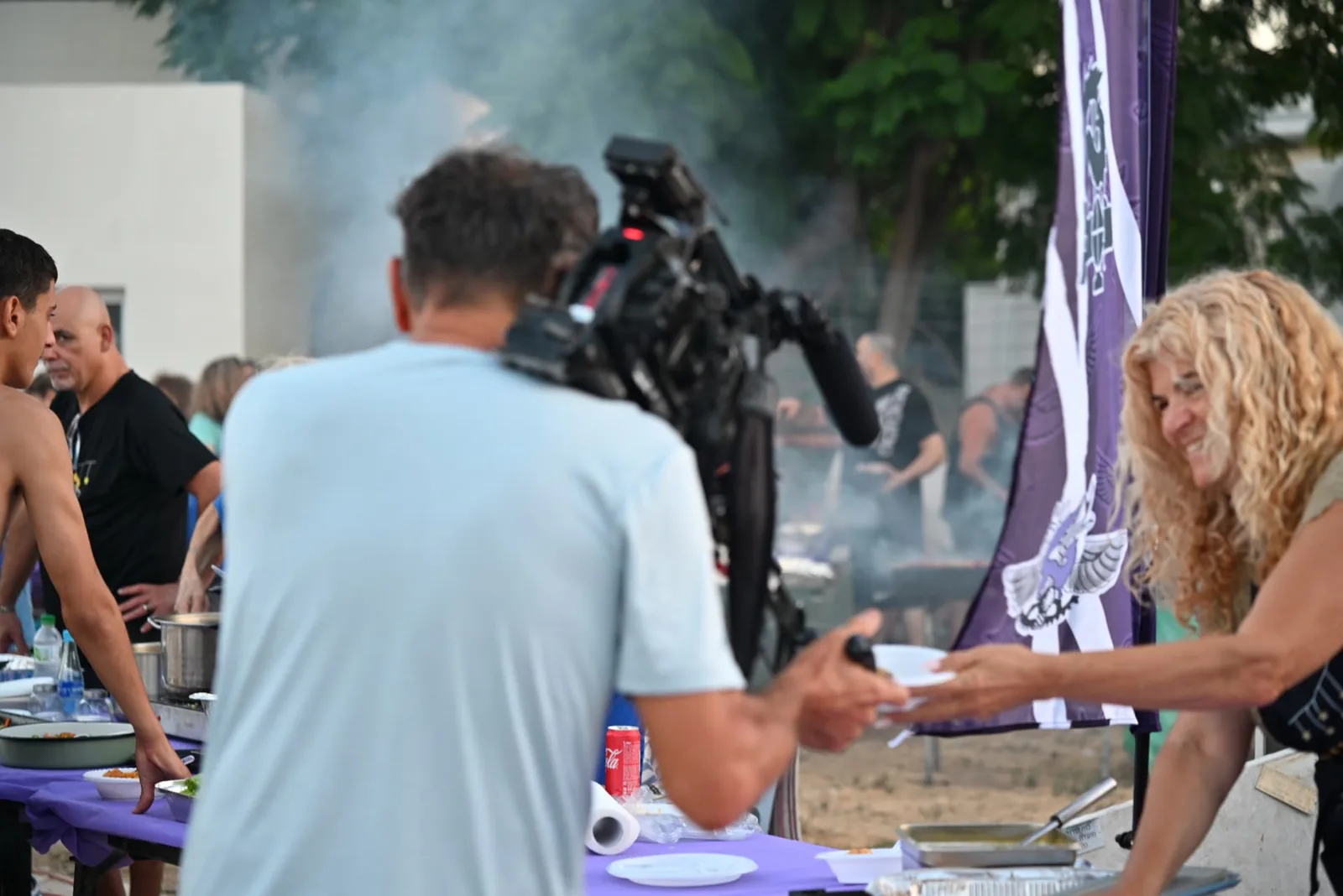 Camera crew filming the serving line
