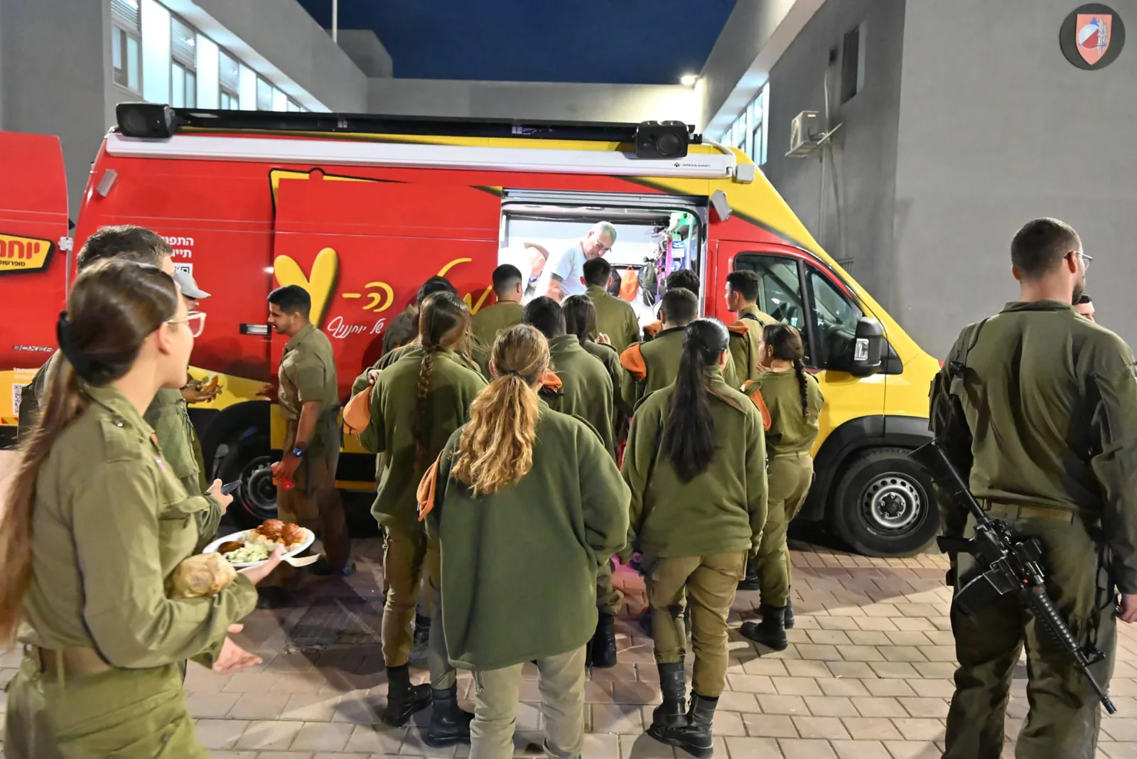 Soldiers gathered at the red food truck