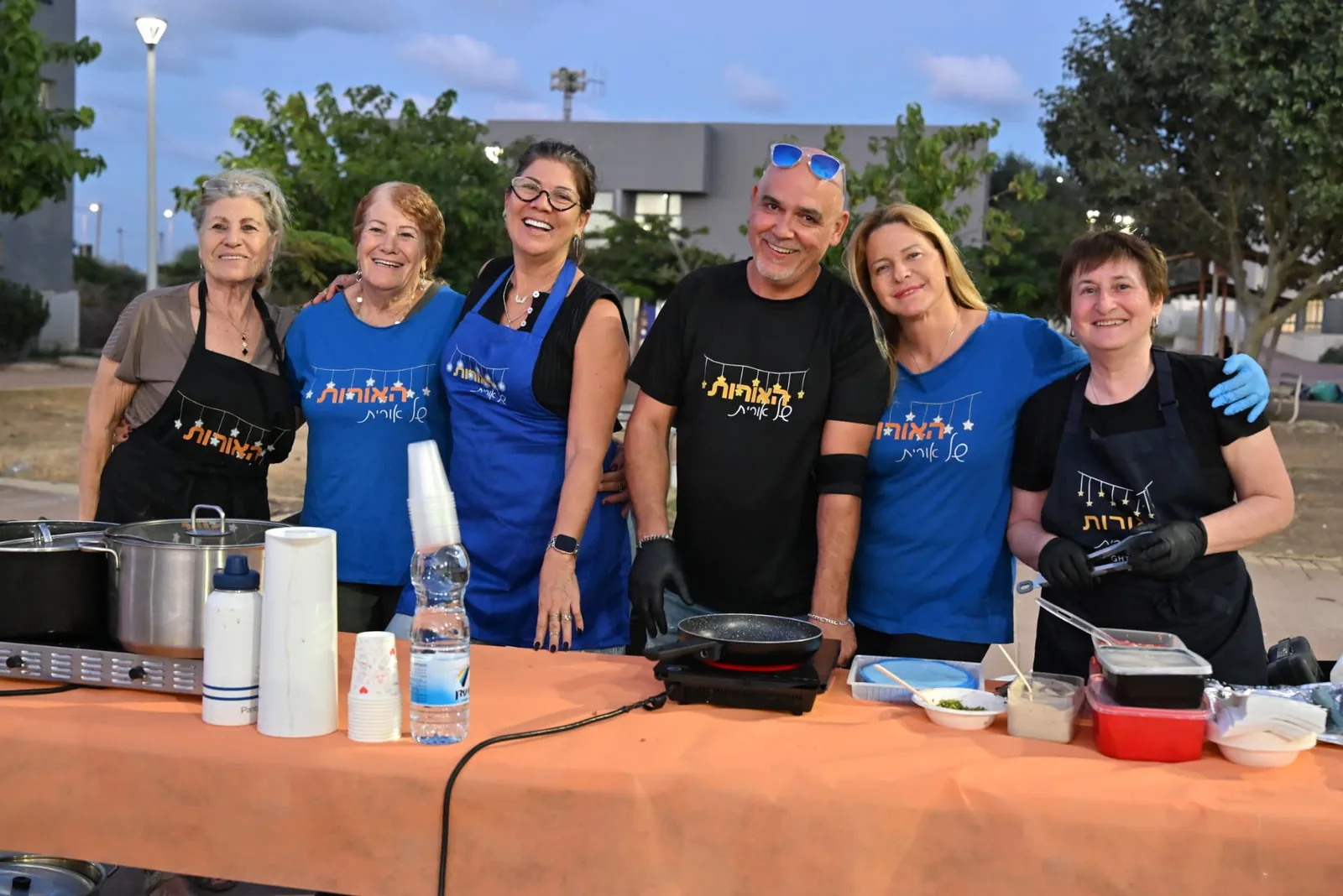 Volunteers together at the food table
