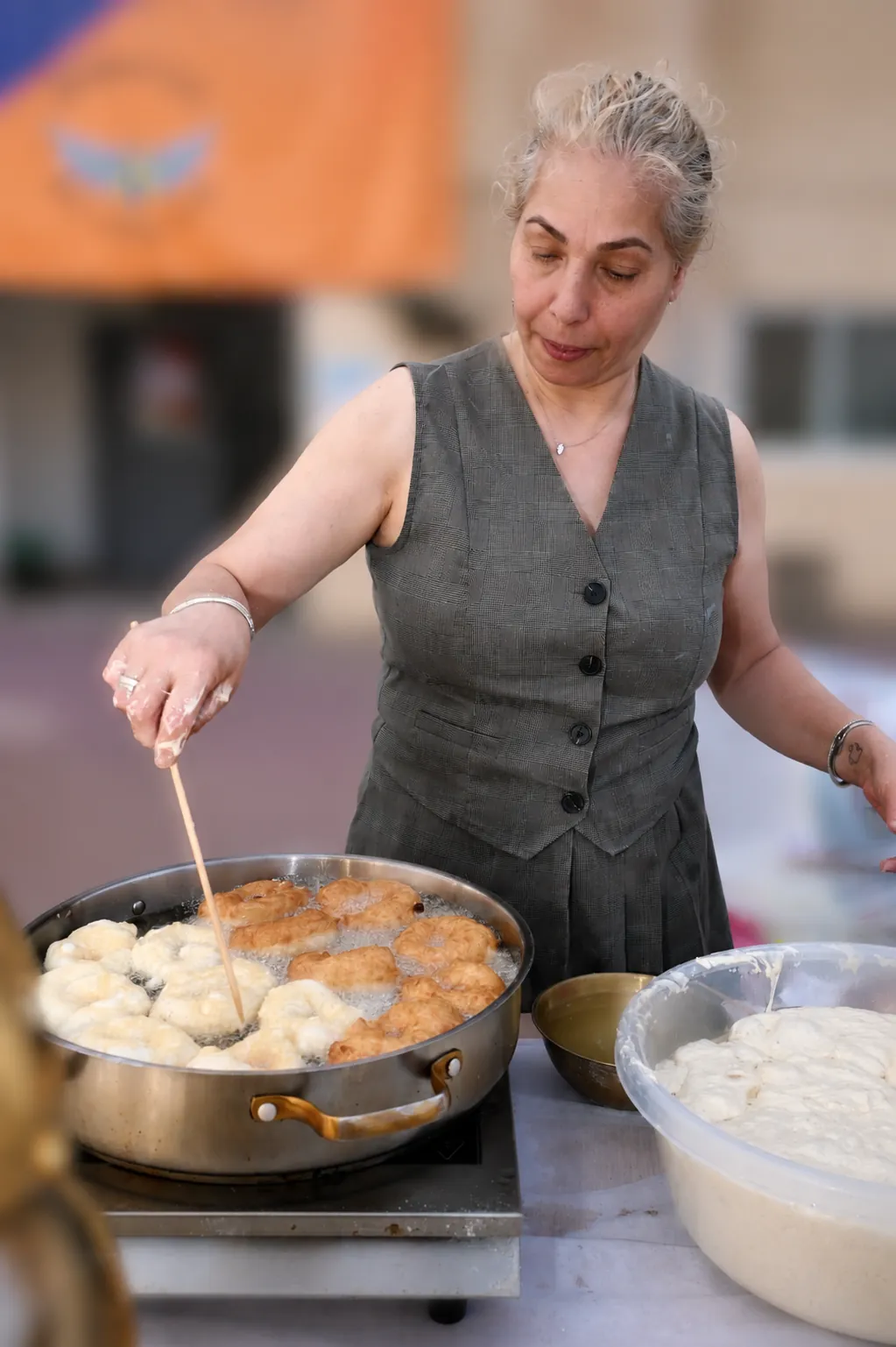 Frying fresh sufganiyot for the troops