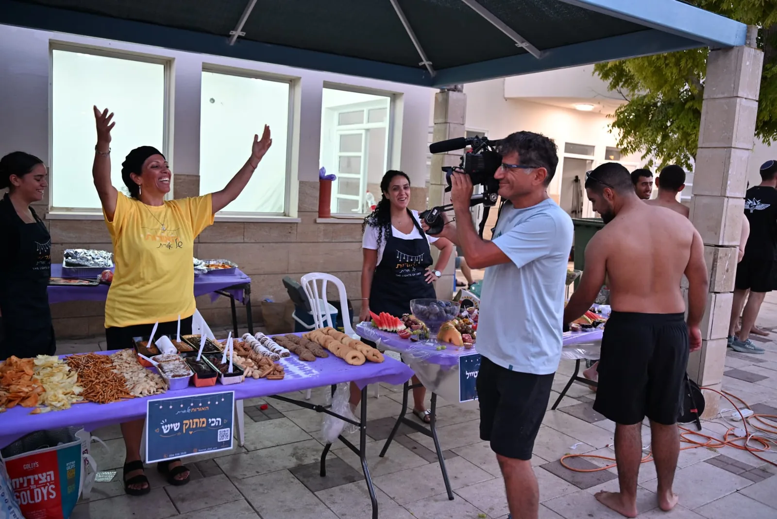 Joyful volunteer at the dessert table